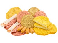 Aufgerollte Scheiben Fleisch-Ersatz, vegane und vegetarische Burger-Scheiben und Würstchen sind abgebildet.