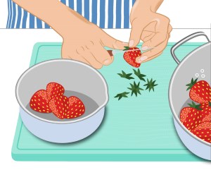 Das Grün von Erdbeeren zum Einfrieren abschneiden