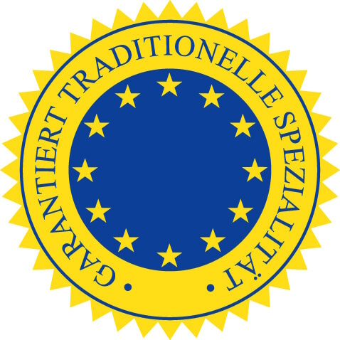 Gelber Ring mit der Aufschrift garantiert traditionelle Spezialitaet um einen blauen Kreis mit gelben Sternen.